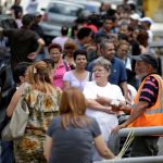 Venezuelan citizens line up to buy food at a store after a strike called to protest against Venezuelan President Nicolas Maduro’s government in Caracas