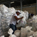 Workers organise humanitarian aid for Venezuela at a warehouse near the Tienditas cross-border bridge between Colombia and Venezuela in Cucuta