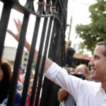 Venezuelan opposition leader Juan Guaido, who many nations have recognised as the country’s rightful interim ruler, greets supporters after his visit to La Chiquinquira church in Maracaibo